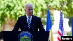 U.S. Vice President Joe Biden addresses a joint media briefing with Romanian President Traian Basescu in Bucharest on May 21.