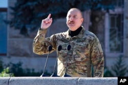 Azerbaijani President Ilham Aliyev speaks in Nagorno-Karabakh in November. Cutting out the mediators against Armenia's will represents another tactic in Azerbaijan's hardball negotiating strategy, says one analyst.