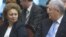 Communist leader Vladimir Voronin (right) speaks to former Prime Minister Zinaida Grecianii before a presidential vote in Chisinau on December 7.