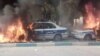 Protesters in Shiraz set police cars on fire, November 16, 2019.