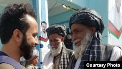 Javid Faisal (L) is campaigning become a member of the Wolesi Jirga, lower house of the Afghan parliament. 