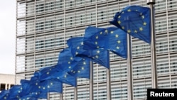 Belgium - European Union flags flutter outside the EU Commission headquarters in Brussels, September 28, 2022.
