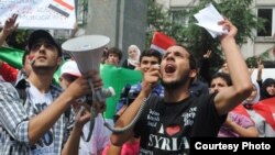 Syrian student Mughira al-Sharif demonstrates against the Assad regime in front of the Syrian Consulate in Istanbul.