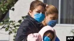 Patients walk in front of the Navy Hospital in Mexico City.