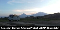 A van loaded with equipment needed for the 2019 dig. In the background is Mount Ararat and the Khor Virap monastery.