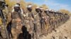 Armed Taliban soldiers attend a training session in Uruzgan Province on December 3.