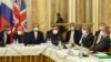 Members of the Iranian delegation wait for the start of nuclear talks in Vienna on November 29. 