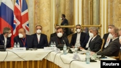 Members of the Iranian delegation wait for the start of nuclear talks in Vienna on November 29. 