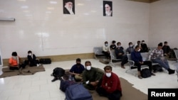 Afghan nationals sit in a refugee camp in the Iranian city of Zahedan. (file photo)