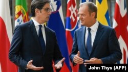 The president of the European Council, Donald Tusk (right), welcomes North Macedonia's president, Stevo Pendarovski, prior to their bilateral meeting at EU headquarters in Brussels on June 12.