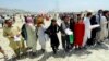 Crowds gather outside the international airport in Kabul on August 17 in the hope of getting a flight out of the country.