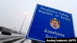 SERBIA -- A Serbian vehicle passes the border between Hungary and Serbia in Horgos, December 19, 2009