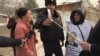 WATCH: Kazakh Woman Pickets Chinese Consulate, Demanding Husband's Release