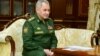 Russian Defense Minister Sergei Shoigu is seen in Minsk at a meeting with Belarusian ruler Alyaksandr Lukashenka on April 10.