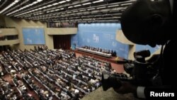 Delegates gather for the opening session of the WTO ministerial conference in Geneva on December 15. 