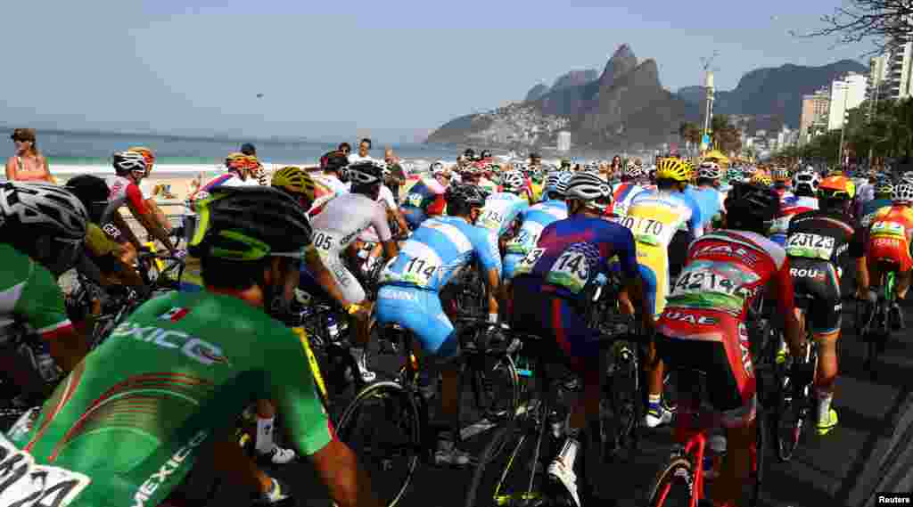 Cyclists start the men&#39;s road race race from Copacabana Beach.