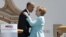 U.S. President Barack Obama (left) and German Chancellor Angela Merkel embrace after delivering remarks in the Bavarian village of Krun on June 7. 
