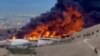 Flames and smoke rise from Tehran’s Shahran oil depot on March 8.