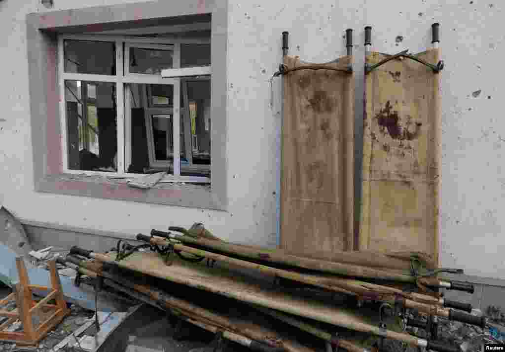 Stretchers are seen outside a hospital that, according to the Foreign Ministry of the Nagorno-Karabakh region, was damaged during recent shelling by Azerbaijani armed forces, in the fighting over the breakaway region of Nagorno-Karabakh, in Martakert on October 15. (Reuters/Stringer)