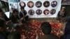 AFGHANISTAN -- Afghan residents pray and light candles to pay tribute to Afghan journalists killed in Monday's suicide attack in Kabul, Afghanistan, Thursday, May 3, 2018.