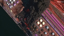 Сателитна снимка показва дим над руското петролно пристанище в Уст-Луга след първата от двете украински атаки през последната седмица. 27 март 2026 г.