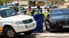 Spanish police officers work near the body (behind blue curtain) of late ex-Ukraine MP Andriy Portnov, after he was shot dead near Madrid on May 21.