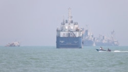 Vessels are pictured in the Strait of Hormuz near Iran's port of Bandar Abbas on June 11.
