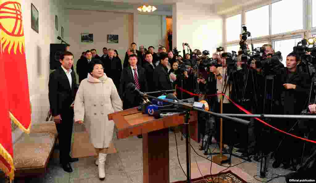 Outgoing leader Roza Otunbaeva arrives to vote at a Bishkek polling station.