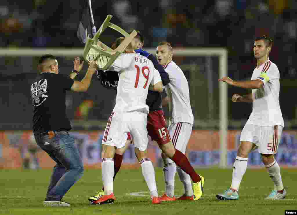 ...with some team officials&nbsp;and&nbsp;fans breaking through security and managing to approach and attack&nbsp;Albanian players. 