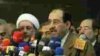 Jawad al-Maliki speaks to the press on April 22