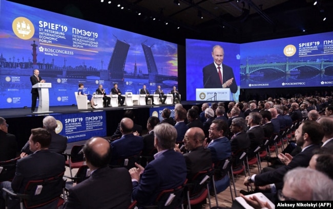 Russian President Vladimir Putin speaks at the St. Petersburg International Economic Forum on June 7. Organizers called it a celebration of Russia’s exit from the pandemic.