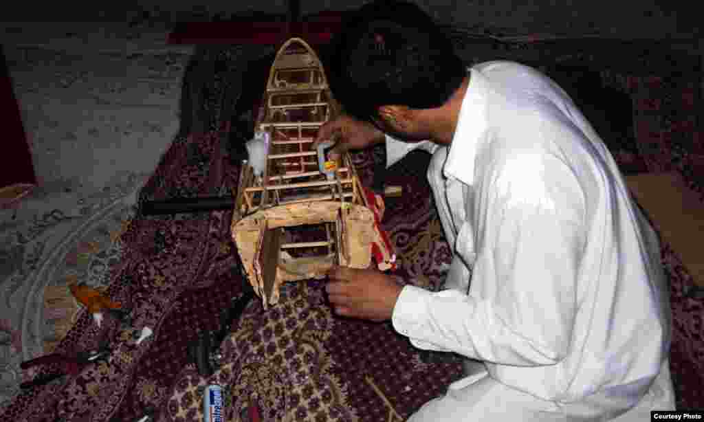 Afghanistan - An Afghan makes drone design plane in southern Afghanistan, 29Mar2012