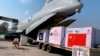 Boxes of the Chinese Sinopharm vaccine for COVID-19 are unloaded from a Pakistan Air Force plane on arrival at Nur Khan Airbase in Rawalpindi on February 1.