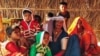 Hindu immigrant woman and children from Pakistan sit at a shelter in Rajasthan, India.