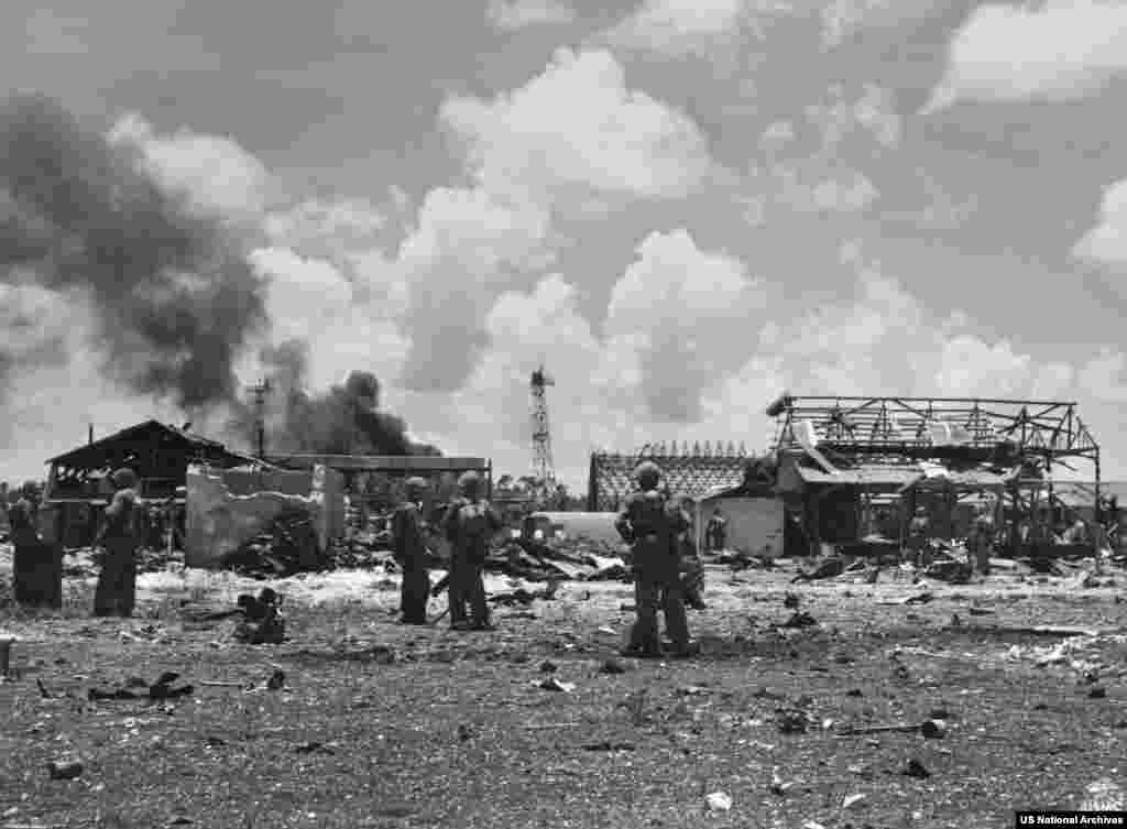 U.S. Marines after arriving at the Japanese airfield on Tinian Island in July 1944.Tinian was captured from Japanese control in August 1944 as the US battled through the Pacific toward the Japanese mainland in the final phase of World War II.
