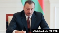 Ilham Aliyev sign