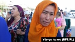 Kyrgyz women wait to cross into Uzbekistan at the Dostyk border crossing, the first to reopen following an agreement signed by the Uzbek and Kyrgyz presidents earlier this month.