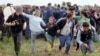Hungarian Camerawoman Convicted For Kicking Fleeing Migrants