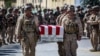 US soldiers act as pallbearers for the 13 service members killed in a bombing at Kabul airport in August 2021. 