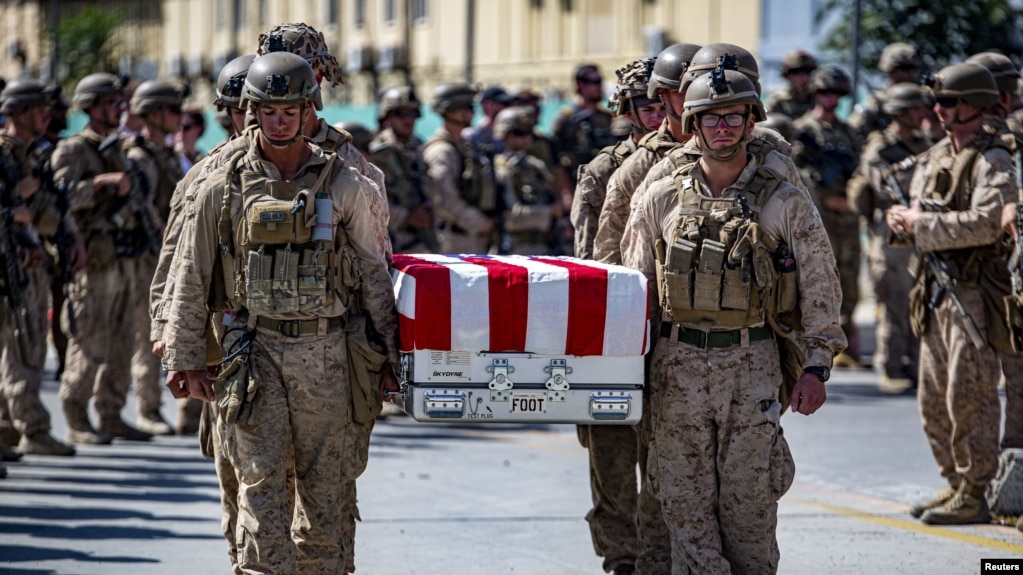 US soldiers act as pallbearers for the 13 service members killed in a bombing at Kabul airport in August 2021. 