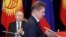 Kyrgyzstan -- Gazprom CEO Aleksei Miller exchanges documents with a member of the Kyrgyz delegation during a signing ceremony following the talks of Presidents Vladimir Putin of Russia and Sooronbai Jeenbekov of Kyrgyzstan in Bishkek, March 28, 2019.