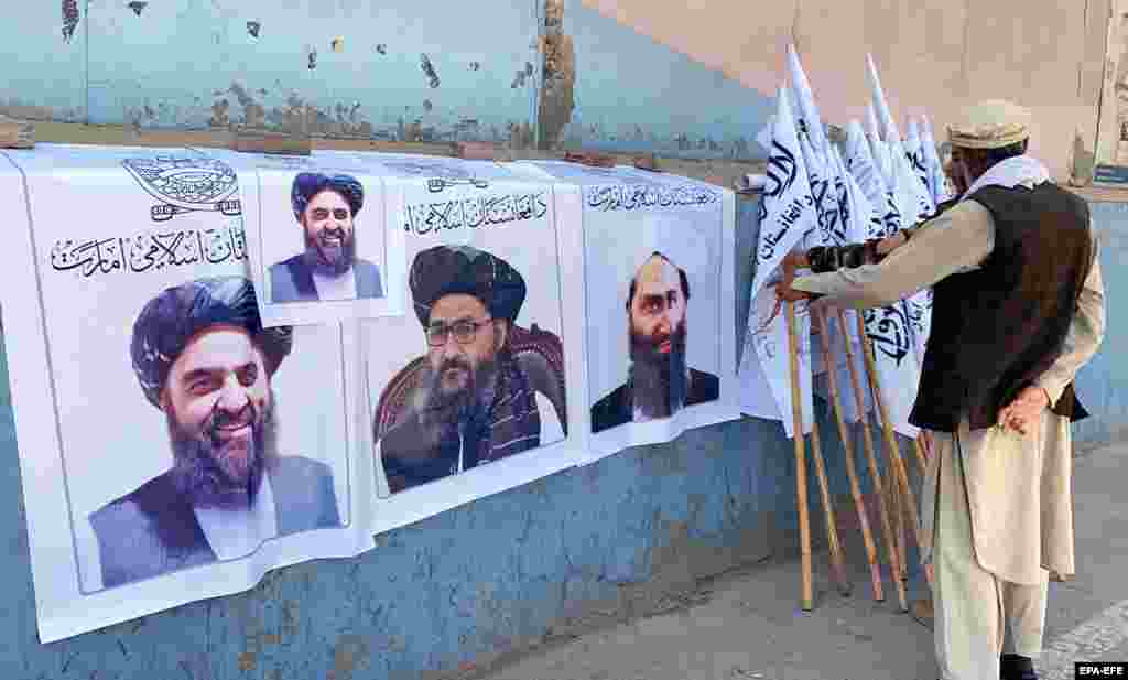 A man sells Taliban flags and posters of the militant group&#39;s leaders in Kabul on August 27. &nbsp; &nbsp;