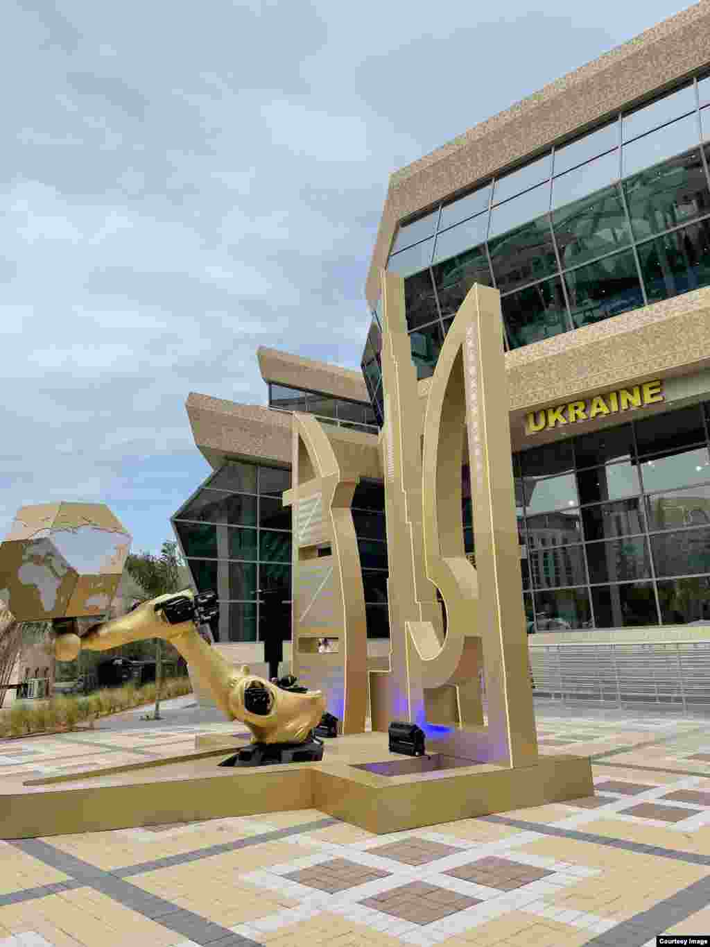 The entrance to the Ukraine pavilion. Visitors to the pavilion are presented with a field created from &ldquo;real ears of wheat, &lsquo;nano-wheat,&rsquo; and digital wheat,&rdquo; which the designers claim &ldquo;symbolically demonstrates Ukraine&#39;s movement into the future in harmony with nature and technological progress.&rdquo;