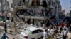 Pakistani troops and rescue workers look for survivors in the rubble following the explosion in Karachi on October 21.