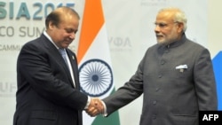 Indian Prime Minister Narendra Modi (R) greets Pakistani Prime Minister Nawaz Sharif in Ufa, Russia, July.