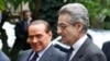Među najčešće spominjanim kandidatima je Antonio Zanardi Landi (prvi zdesna). Arhivska fotografija Landija s tadašnjim premijerom Italije Silvijom Berlusconijem u Rimu, 9. 12. 2010.