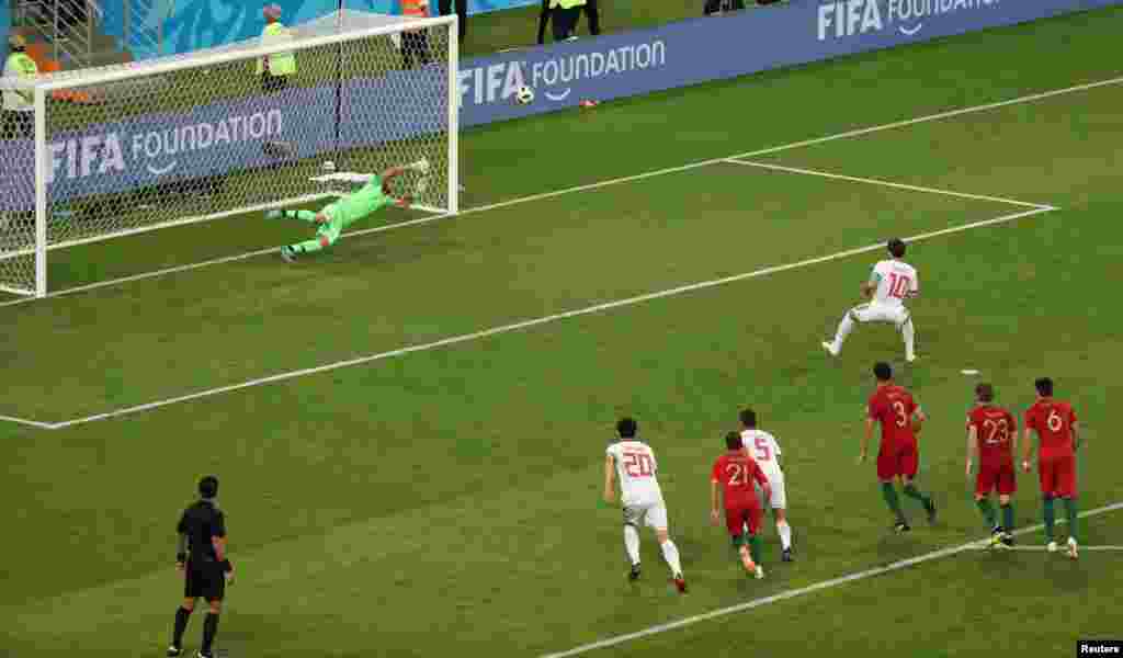 Soccer Football - World Cup - Group B - Iran vs Portugal - Mordovia Arena, Saransk, Russia - June 25, 2018 Iran's Karim Ansarifard scores their first goal from the penalty spot REUTERS/Lucy Nicholson