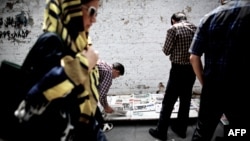 People in the capital, Tehran, reading newspapers the day the shortlist of presidential candidates for the June 14 election was announced.