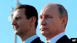 Сирискиот претседател Башар ал Асад и рускиот претседател Владимир Путин