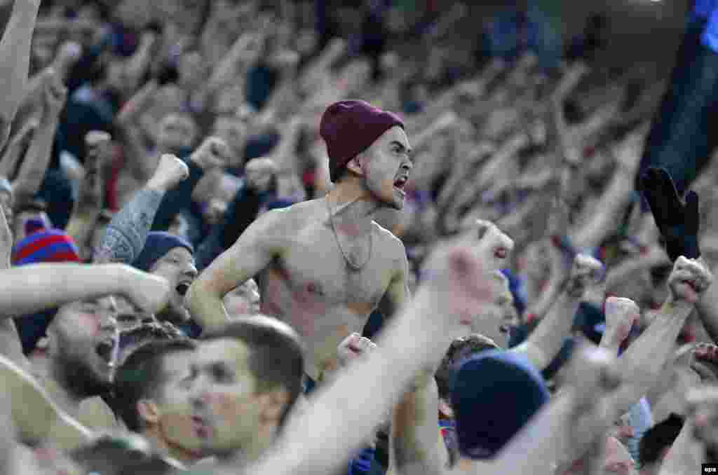 Fans of CSKA Moscow celebrate a goal during the UEFA Champions League Group E soccer match between CSKA Moscow and AS Monaco at CSKA Arena stadium in Moscow. The match ended in a 1-1 draw. (epa/Sergei Ilnitsky)